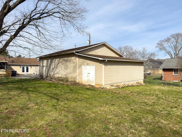 view of outbuilding with fence