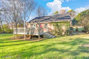 8836 Nubbin Ridge Rd, Knoxville, TN 37923 - back of property featuring a deck and a lawn
