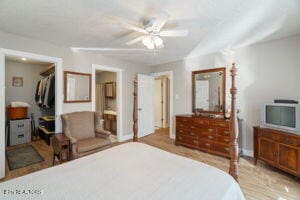 8836 Nubbin Ridge Rd, Knoxville, TN 37923 - bedroom featuring a closet, baseboards, a walk in closet, and wood finished floors