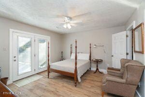 8836 Nubbin Ridge Rd, Knoxville, TN 37923 - bedroom featuring french doors, access to exterior, light wood finished floors, and a ceiling fan