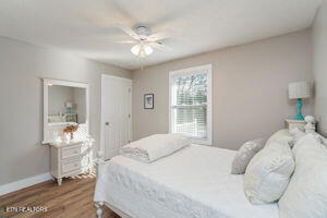 8836 Nubbin Ridge Rd, Knoxville, TN 37923 - bedroom with baseboards, ceiling fan, and wood finished floors