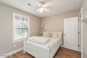 8836 Nubbin Ridge Rd, Knoxville, TN 37923 - bedroom featuring visible vents, baseboards, ceiling fan, and wood finished floors