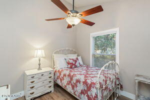 8836 Nubbin Ridge Rd, Knoxville, TN 37923 - bedroom featuring ceiling fan and wood finished floors