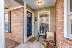 8836 Nubbin Ridge Rd, Knoxville, TN 37923 - doorway to property with brick siding and covered porch