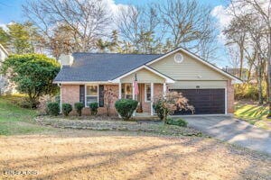 8836 Nubbin Ridge Rd, Knoxville, TN 37923 - ranch-style home with a garage and driveway