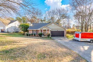 8836 Nubbin Ridge Rd, Knoxville, TN 37923 - ranch-style house featuring driveway and a garage
