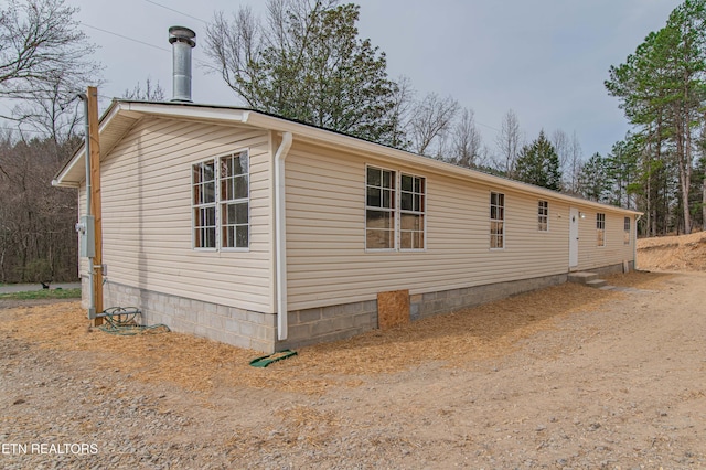 view of property exterior featuring crawl space