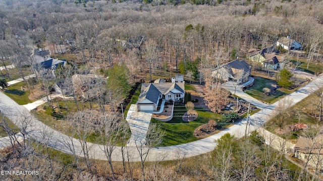 bird's eye view featuring a view of trees