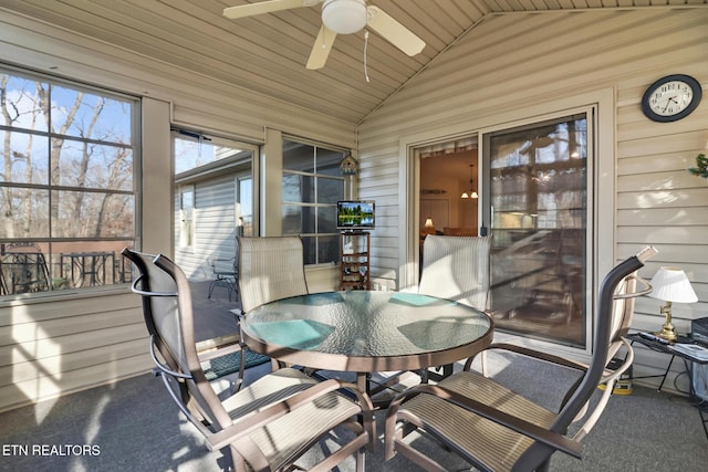 sunroom / solarium featuring lofted ceiling and ceiling fan