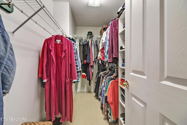 spacious closet featuring tile patterned floors