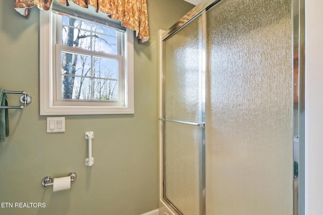 full bathroom featuring a shower with shower door