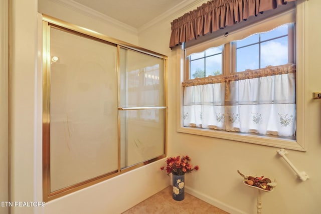 full bathroom featuring plenty of natural light, baseboards, bath / shower combo with glass door, and ornamental molding