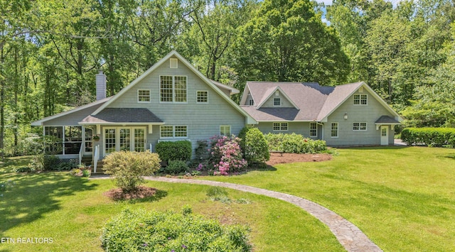 1025 Lowe Rd, Cohutta, GA 30710 - rear view of property featuring a chimney, a sunroom, a lawn, and a shingled roof