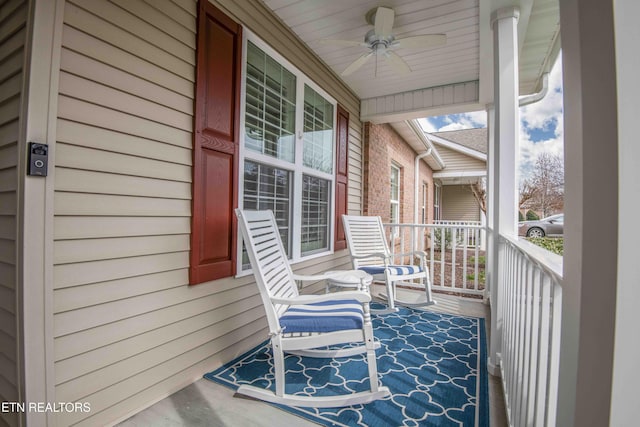 balcony featuring a porch and a ceiling fan