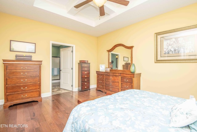 bedroom with wood finished floors, baseboards, coffered ceiling, ceiling fan, and beamed ceiling