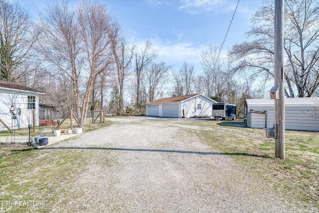 view of road with gravel driveway