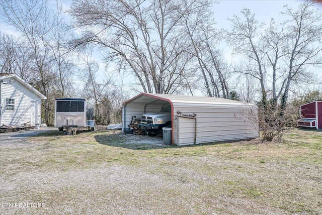 exterior space featuring a carport and driveway