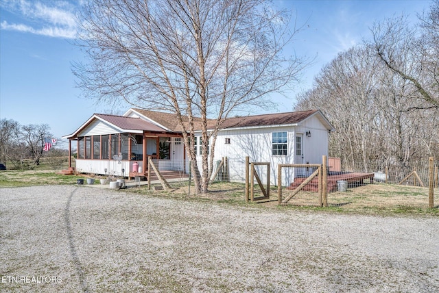 view of front facade featuring a sunroom