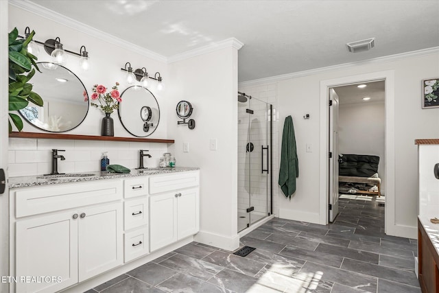 bathroom featuring a sink, double vanity, and crown molding