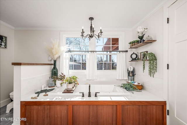 bar featuring a notable chandelier and crown molding