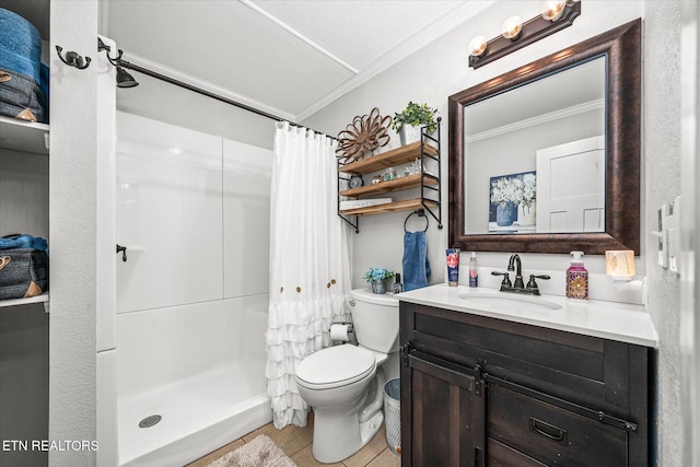 full bath with vanity, a stall shower, crown molding, and toilet