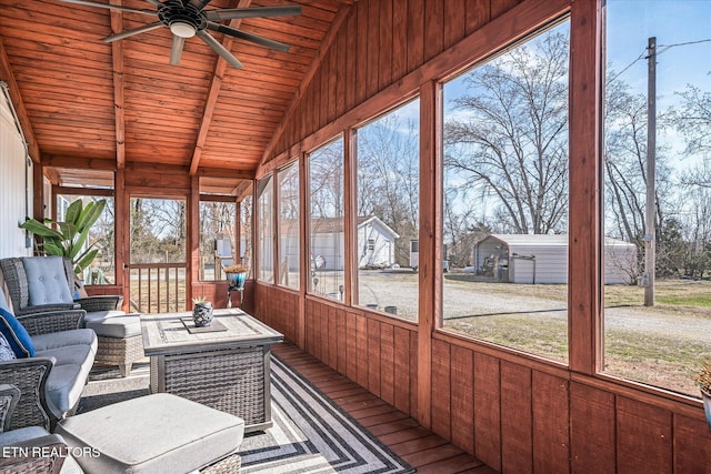 unfurnished sunroom with wooden ceiling, vaulted ceiling with beams, a healthy amount of sunlight, and ceiling fan