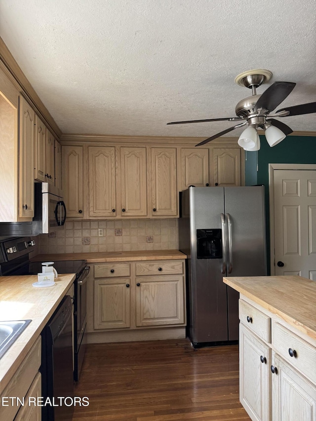 kitchen featuring dark wood finished floors, backsplash, black appliances, and ceiling fan