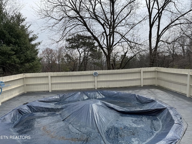 view of pool with a fenced backyard