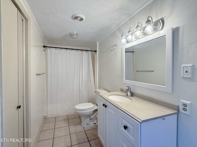 bathroom featuring vanity, toilet, ornamental molding, a textured ceiling, and tile patterned floors