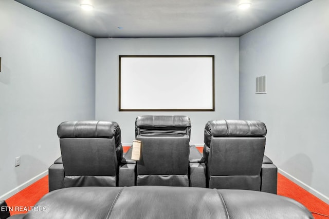 home theater with visible vents, baseboards, and wood finished floors