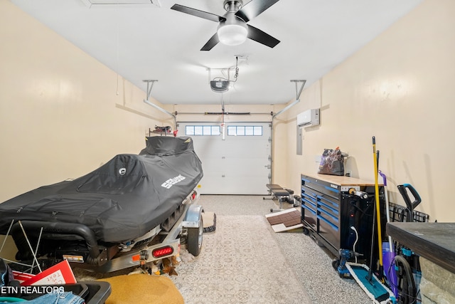 garage with an AC wall unit, a garage door opener, and ceiling fan