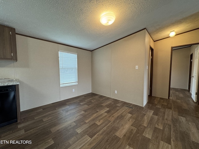 unfurnished living room with crown molding, dark wood-style flooring, and a textured ceiling