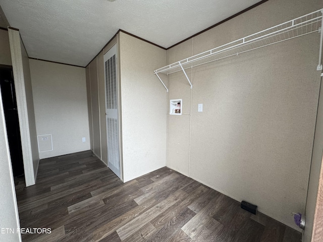 laundry room with dark wood-style floors, laundry area, hookup for a washing machine, and a textured ceiling