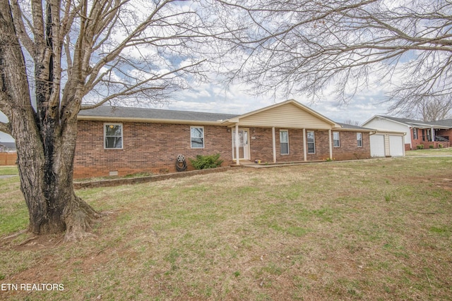 single story home with crawl space, brick siding, an attached garage, and a front yard