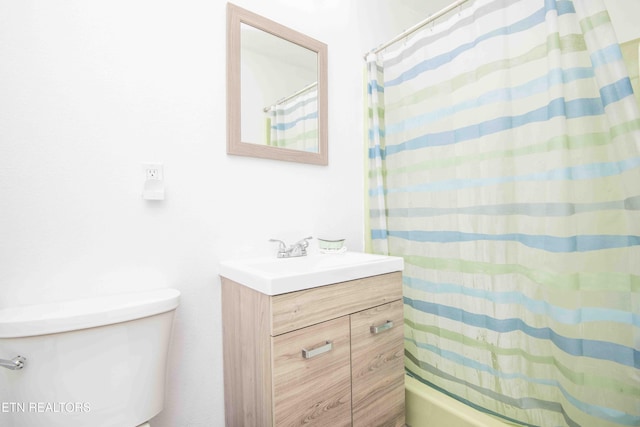 full bathroom featuring vanity, toilet, and shower / bathtub combination with curtain