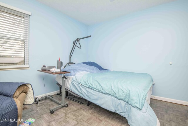 bedroom featuring baseboards