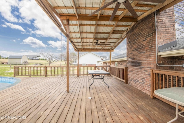 wooden deck featuring ceiling fan