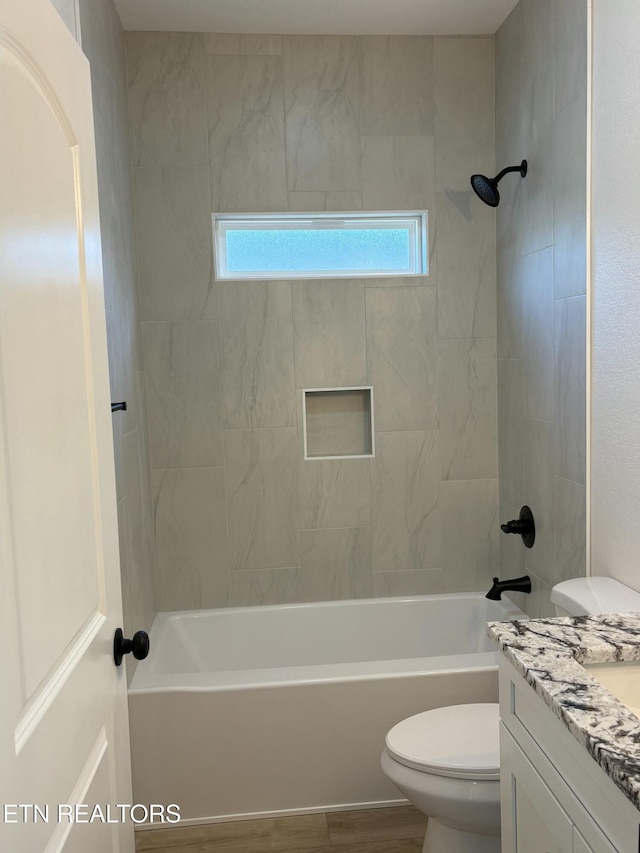 full bathroom featuring toilet, vanity, and shower / tub combination