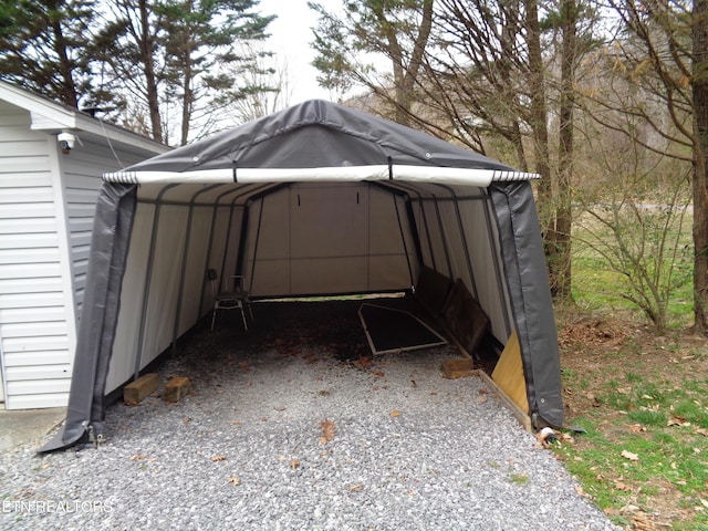 view of vehicle parking featuring a detached carport