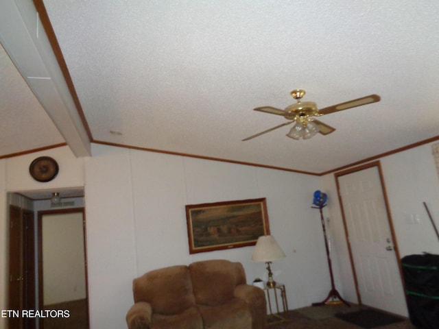 living room featuring a ceiling fan, lofted ceiling, and crown molding