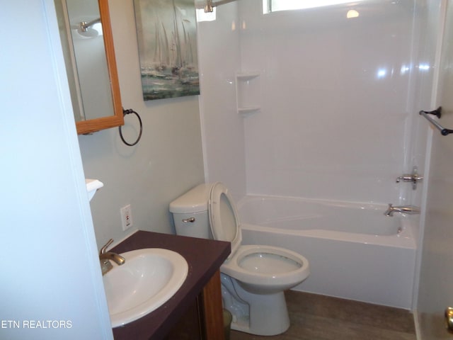 bathroom featuring tub / shower combination, toilet, and vanity