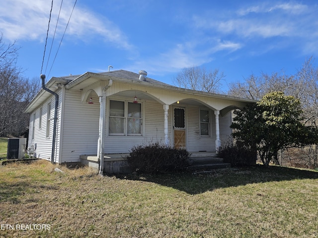 view of front of house with a porch and a front lawn