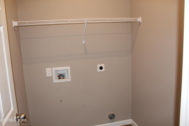 clothes washing area with laundry area, hookup for an electric dryer, and washer hookup