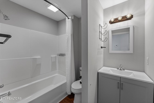 full bathroom with vanity, shower / bath combination with curtain, toilet, and wood finished floors