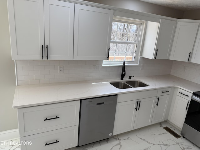 kitchen with visible vents, appliances with stainless steel finishes, marble finish floor, white cabinetry, and a sink