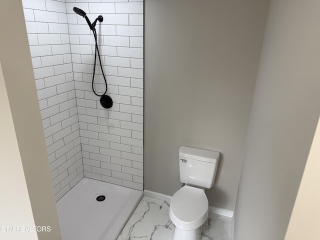 full bathroom featuring marble finish floor, toilet, a shower stall, and baseboards