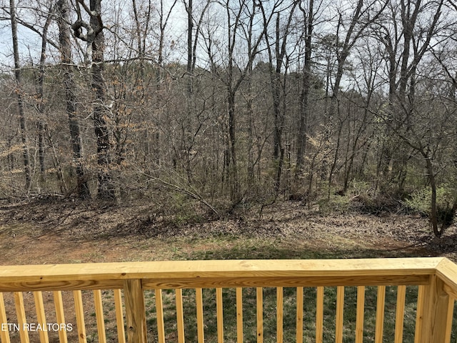 view of yard with a wooded view