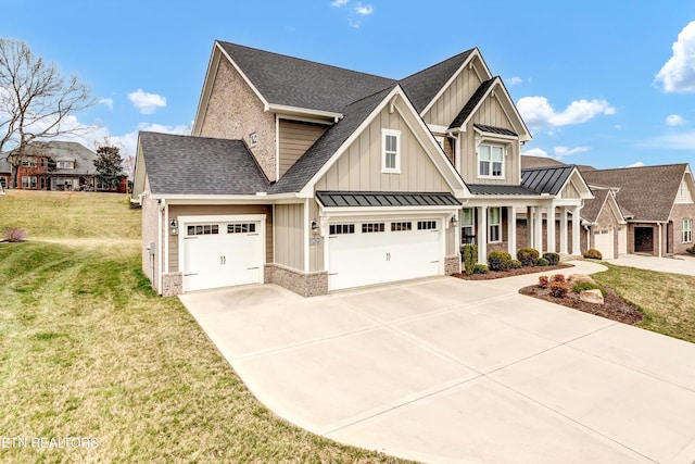 view of front facade with board and batten siding, a shingled roof, a front lawn, driveway, and a standing seam roof