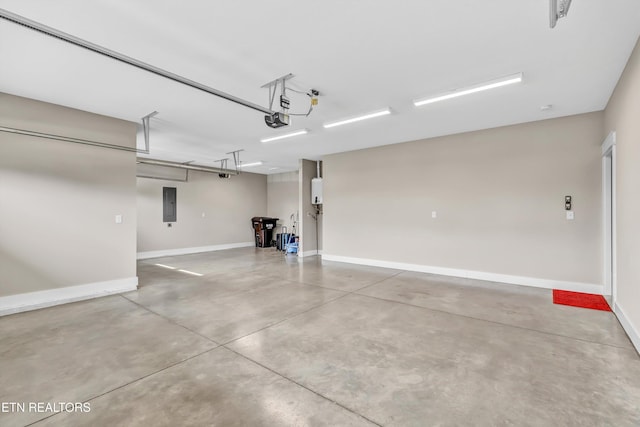 garage featuring electric panel, baseboards, and a garage door opener