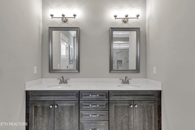 full bathroom featuring a sink and double vanity